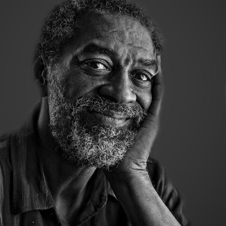 Kaveri Mehta, Lead Design Curator at StoneMarketMarketplace, reviewing corporate floral arrangements